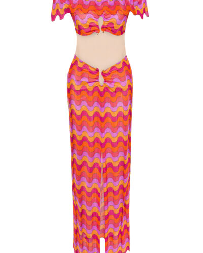 Colorful retro two-piece outfit with wavy pink, orange, and yellow pattern, featuring an off-shoulder crop top and matching skirt with cutout details