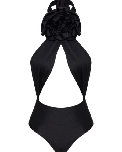 This is a stylish black halter-neck one-piece swimsuit with a unique design featuring a dramatic, voluminous ruffle at the chest, creating a floral or layered effect. The swimsuit has a cut-out detail under the ruffle, exposing part of the torso in a subtle yet elegant way. The material looks sleek and slightly glossy, enhancing the sophistication of the piece.