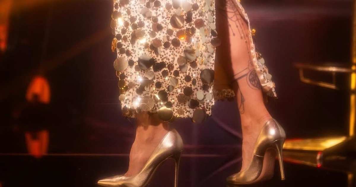 Sıla Gençoğlu wearing Uptown Luxe gold sequin dress by Nana Gotti during her European tour performance Sıla Gençoğlu wearing Uptown Luxe gold sequin dress by Nana Gotti during her European tour performance