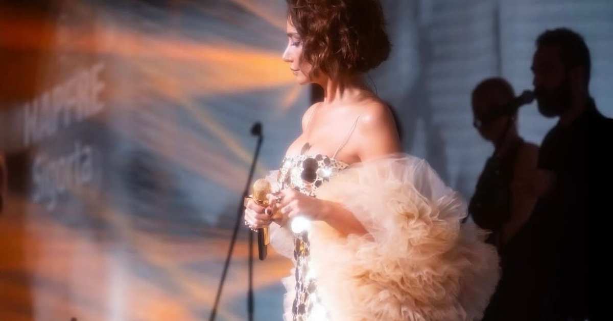 Sıla Gençoğlu wearing Uptown Luxe gold sequin dress by Nana Gotti during her European tour performance Sıla Gençoğlu wearing Uptown Luxe gold sequin dress by Nana Gotti during her European tour performance