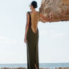 Back view of Nana Gotti Lara olive green maxi dress featuring dramatic cascading gold chain draping and a center back slit.