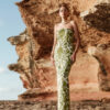 Model wearing Flora Strapless Floral Twill Satin Maxi Dress by Nana Gotti outdoors