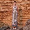Full-length front view of Nana Gotti Yara strapless linen maxi dress featuring a fitted silhouette and intricate blue, green and yellow floral and wildlife print.