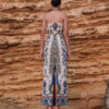 Back view of the Nana Gotti Yara printed linen strapless maxi dress with a fitted waist, colorful botanical pattern and elegant center-back slit