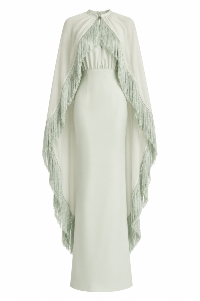 Nerina Mint Green Fringe Cape Maxi Dress by Nana Gotti, featuring a high neckline, fitted crepe silhouette, flowing chiffon cape, and cascading fringe detailing, front view.
