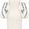 Back view of Nana Gotti Lalezar ivory mini dress featuring a concealed zipper, fitted silhouette and voluminous blue floral balloon sleeves.