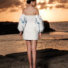 Back view of Nana Gotti Lalezar ivory mini dress featuring a concealed zipper, fitted silhouette and voluminous blue floral balloon sleeves.